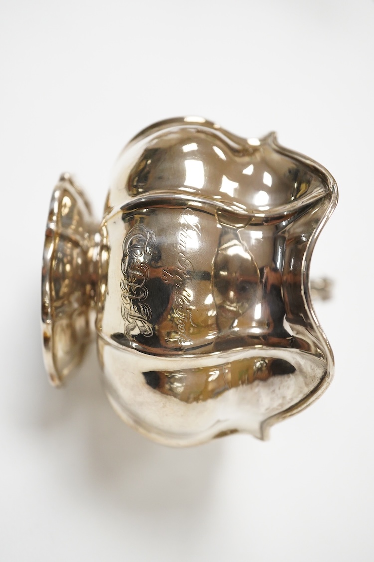 A George IV silver cream jug, with engraved monogram, by William, Charles and Henry Eley, London, 1824, height 10.5cm, 7.7oz.